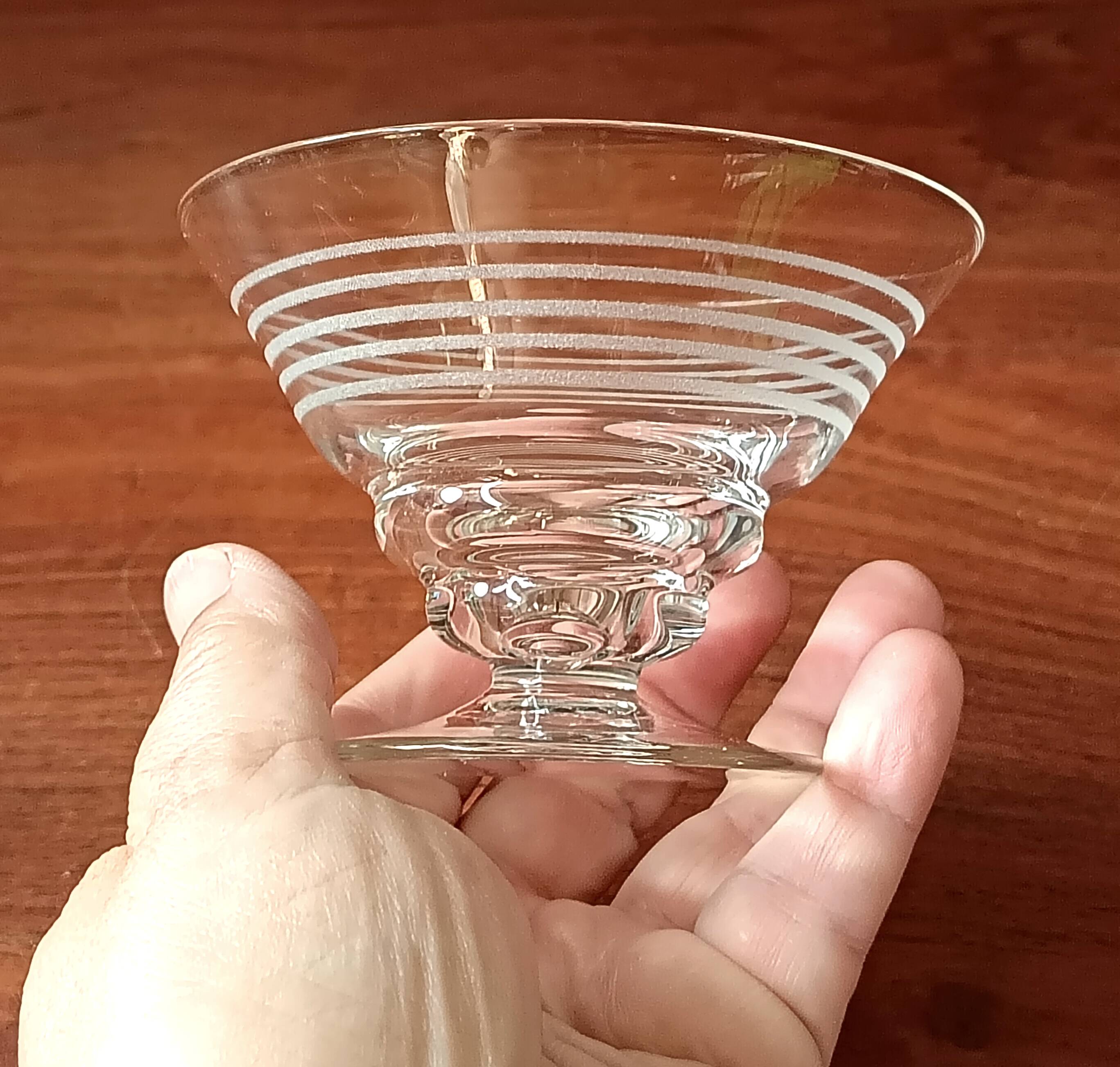 8 conical glasses with a vintage 1950s line pattern.
