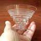 8 conical glasses with a vintage 1950s line pattern.
