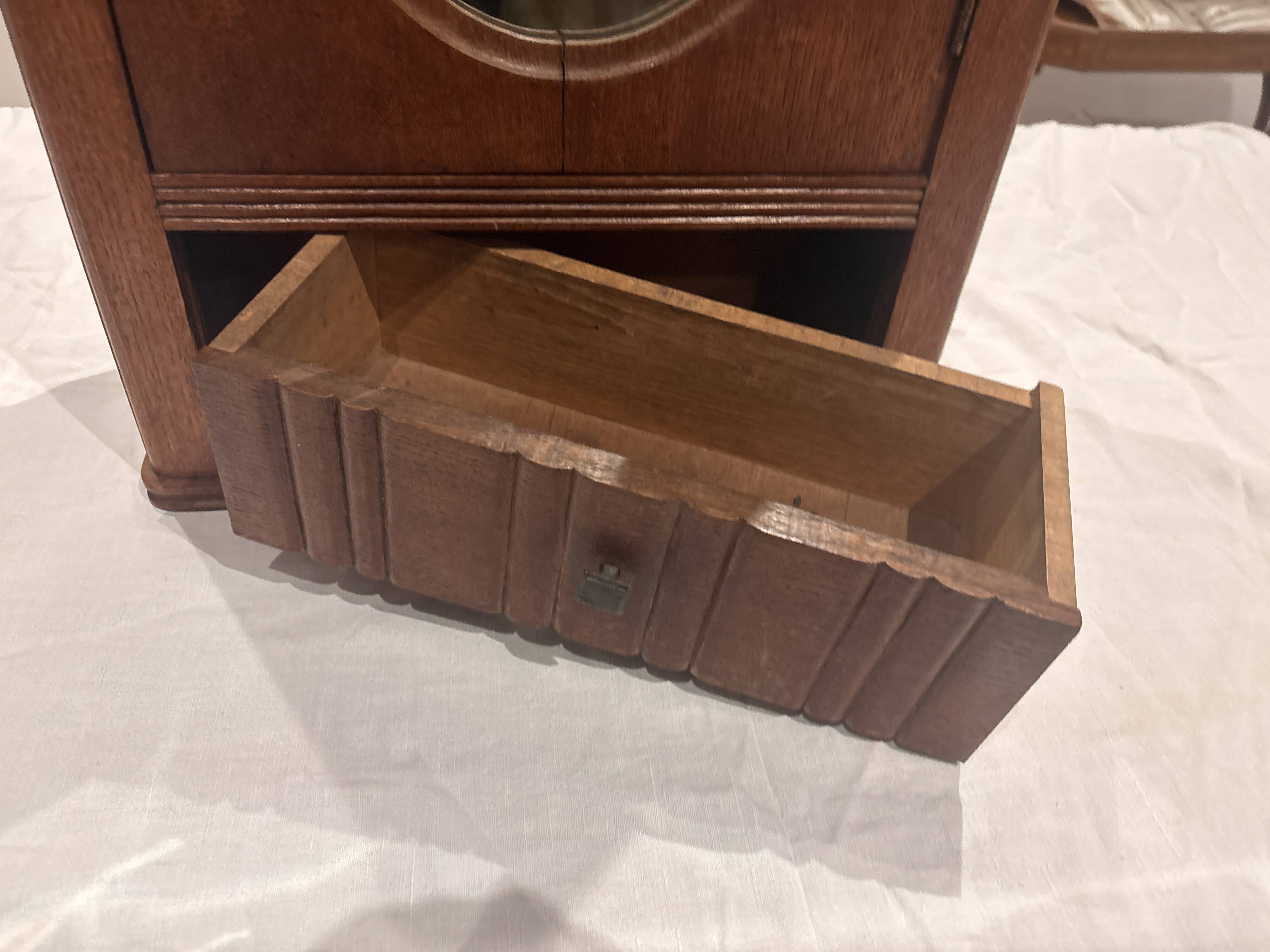 Wall cabinet with oval wall and drawer