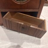 Wall cabinet with oval wall and drawer