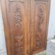pair of antique solid oak cabinet doors with bird decor
