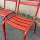 2 red metal Tolix-style chairs, France 1950