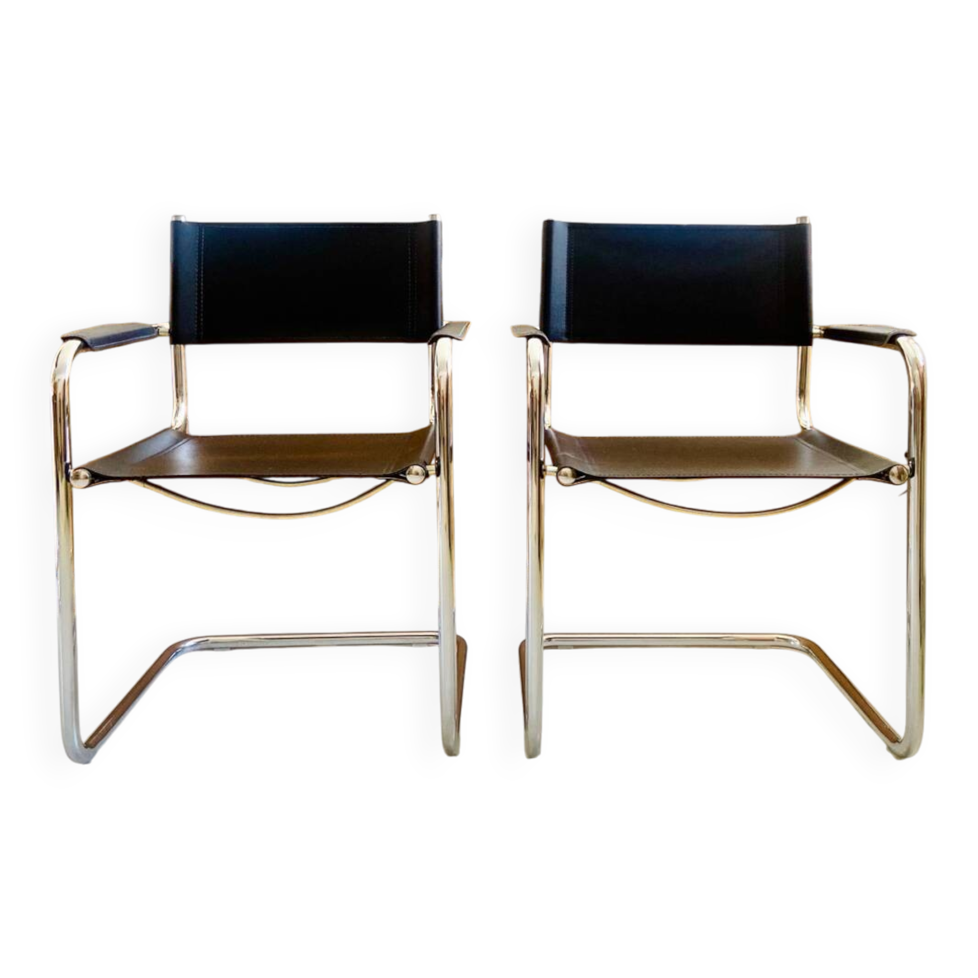 Pair of vintage chrome and black faux leather armchairs