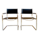 Pair of vintage chrome and black faux leather armchairs