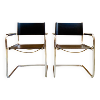 Pair of vintage chrome and black faux leather armchairs