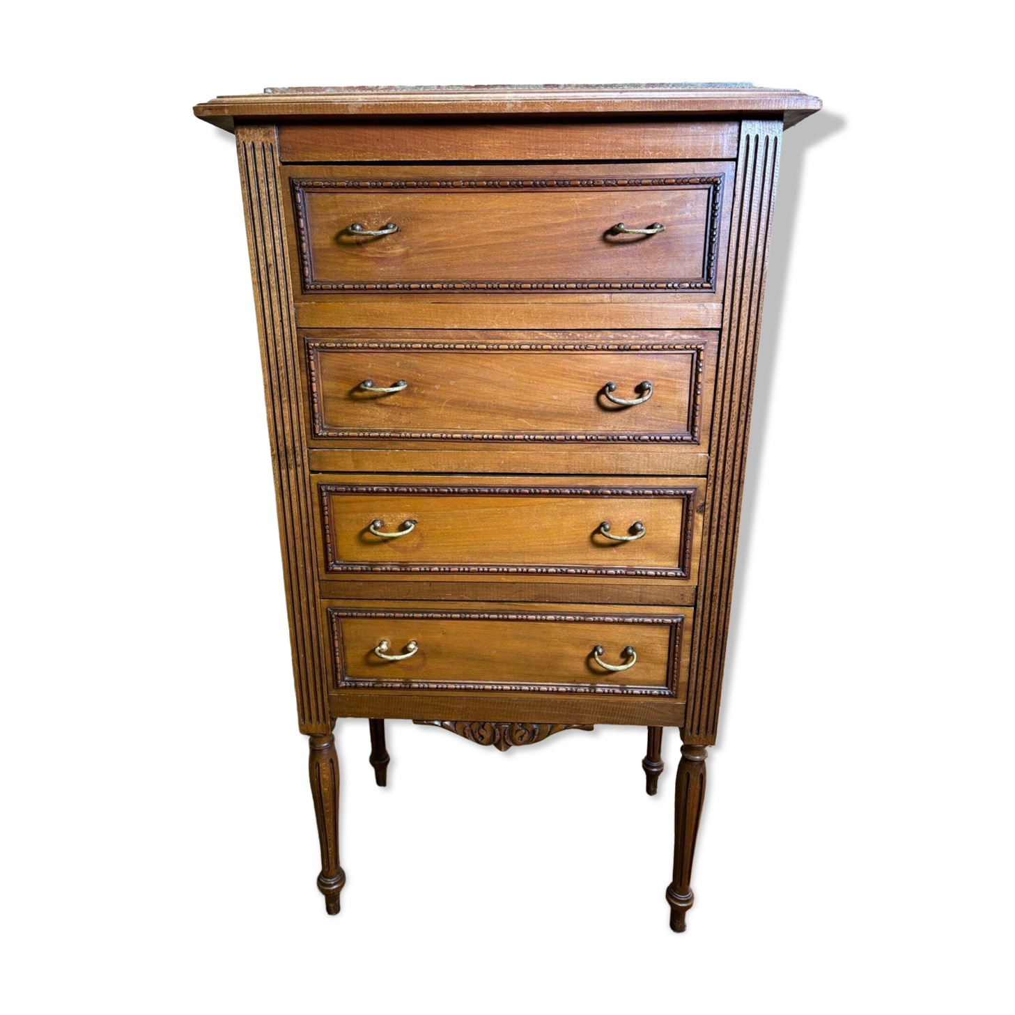 Louis XVI style molded and carved walnut chest of drawers