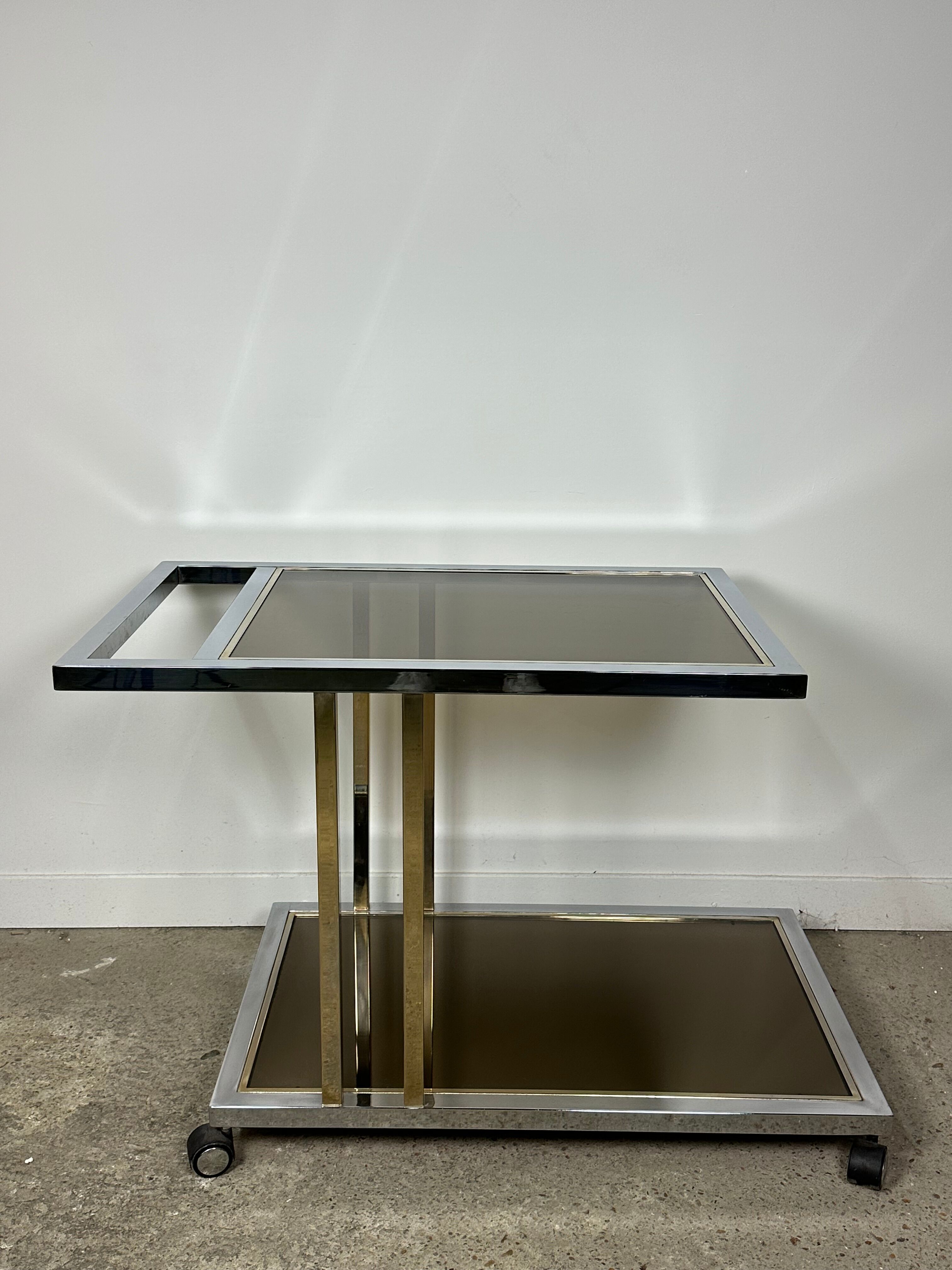 Belgo chrome serving cart/rolling table in chromed and gold-plated brass, 70s