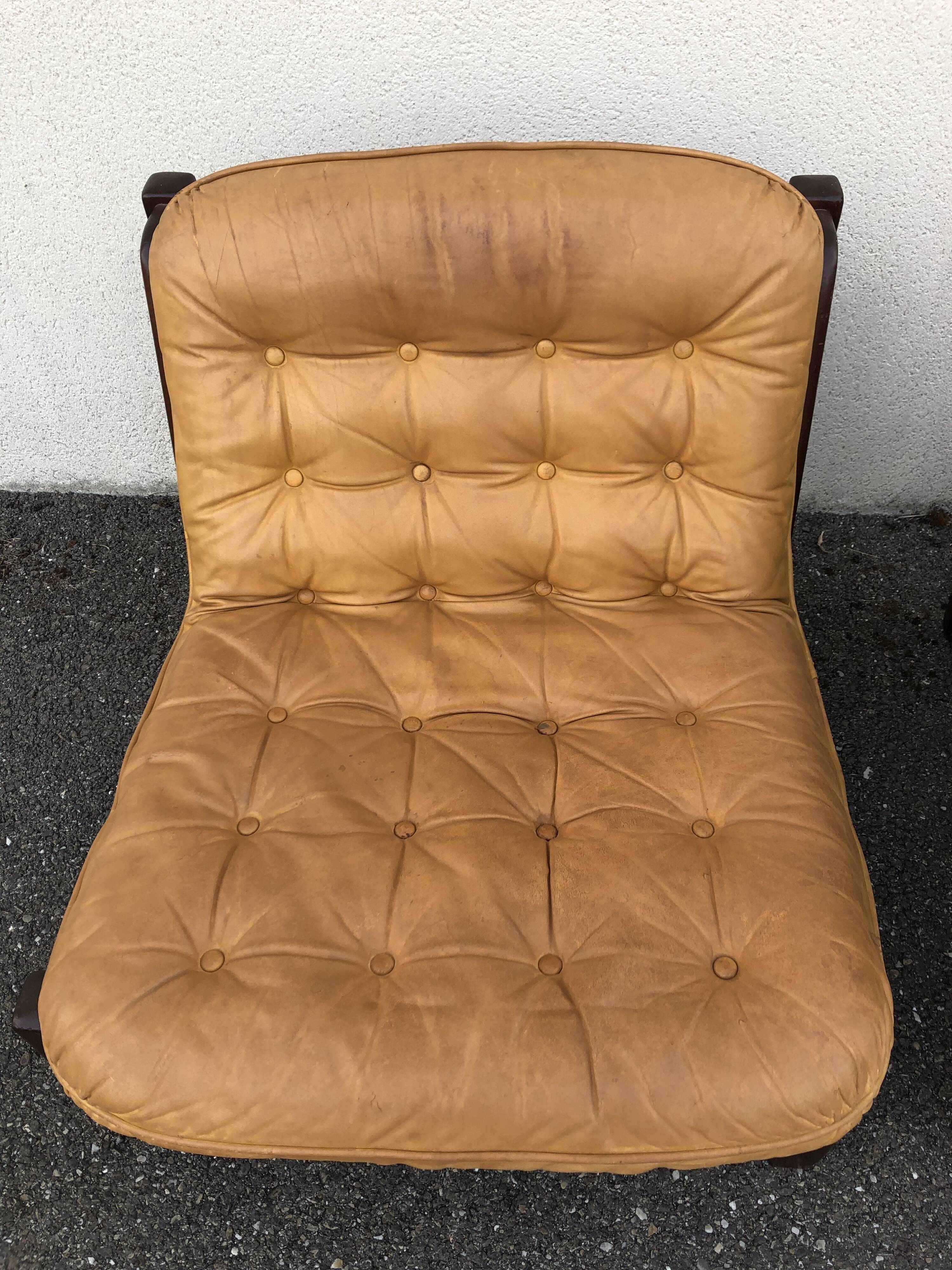 Leather and wood armchairs 70s
