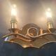 Copper wall lamp with 1940s Art Deco shades.