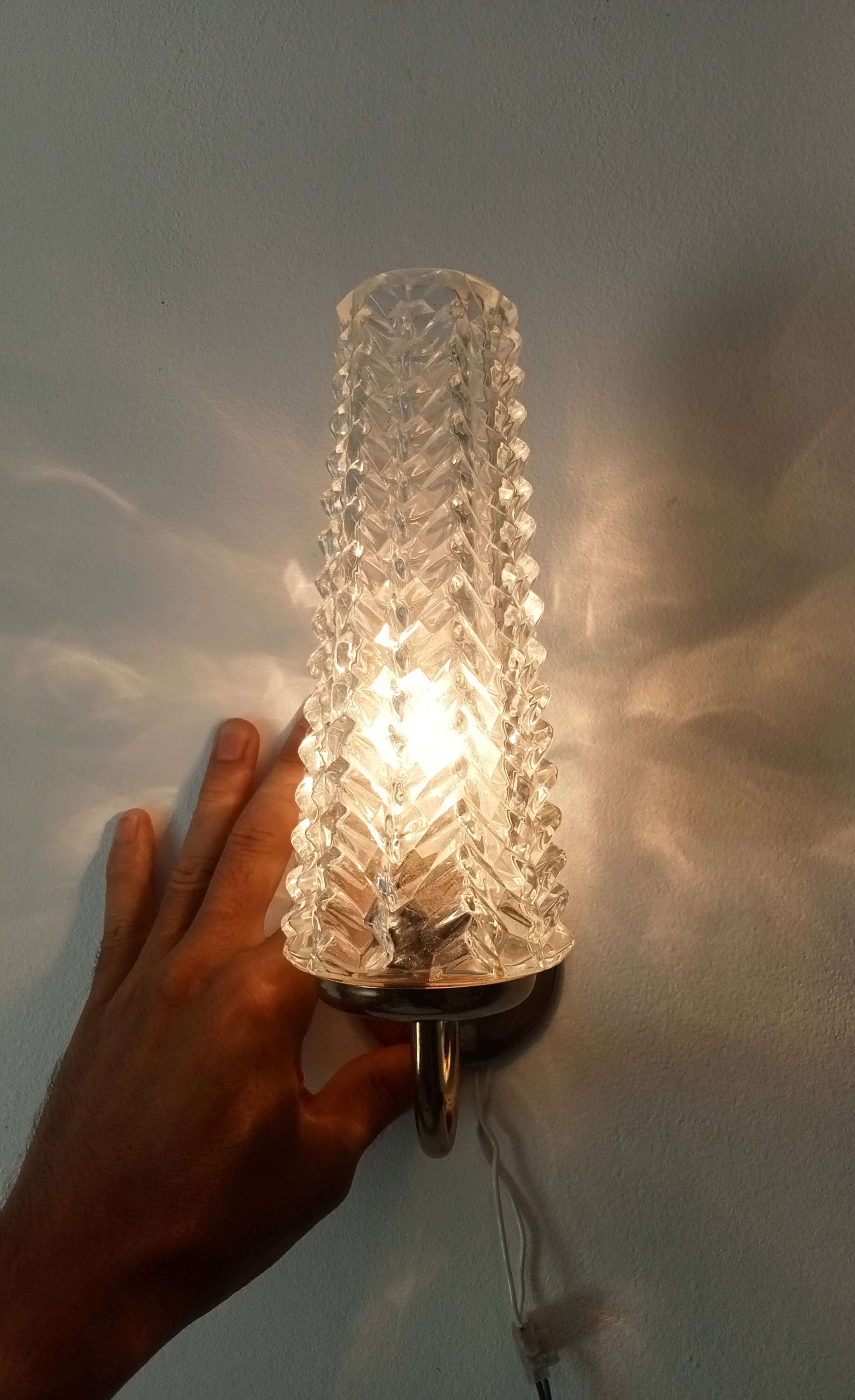 Vintage wall light in brass and etched glass.