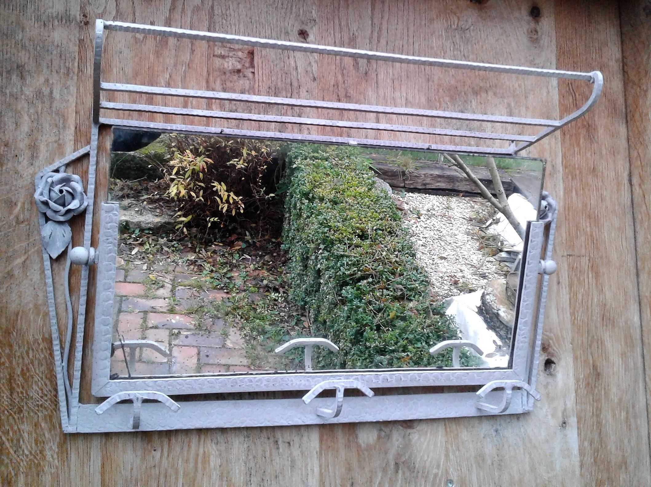 Former Wall coat hangers painted in gray iron