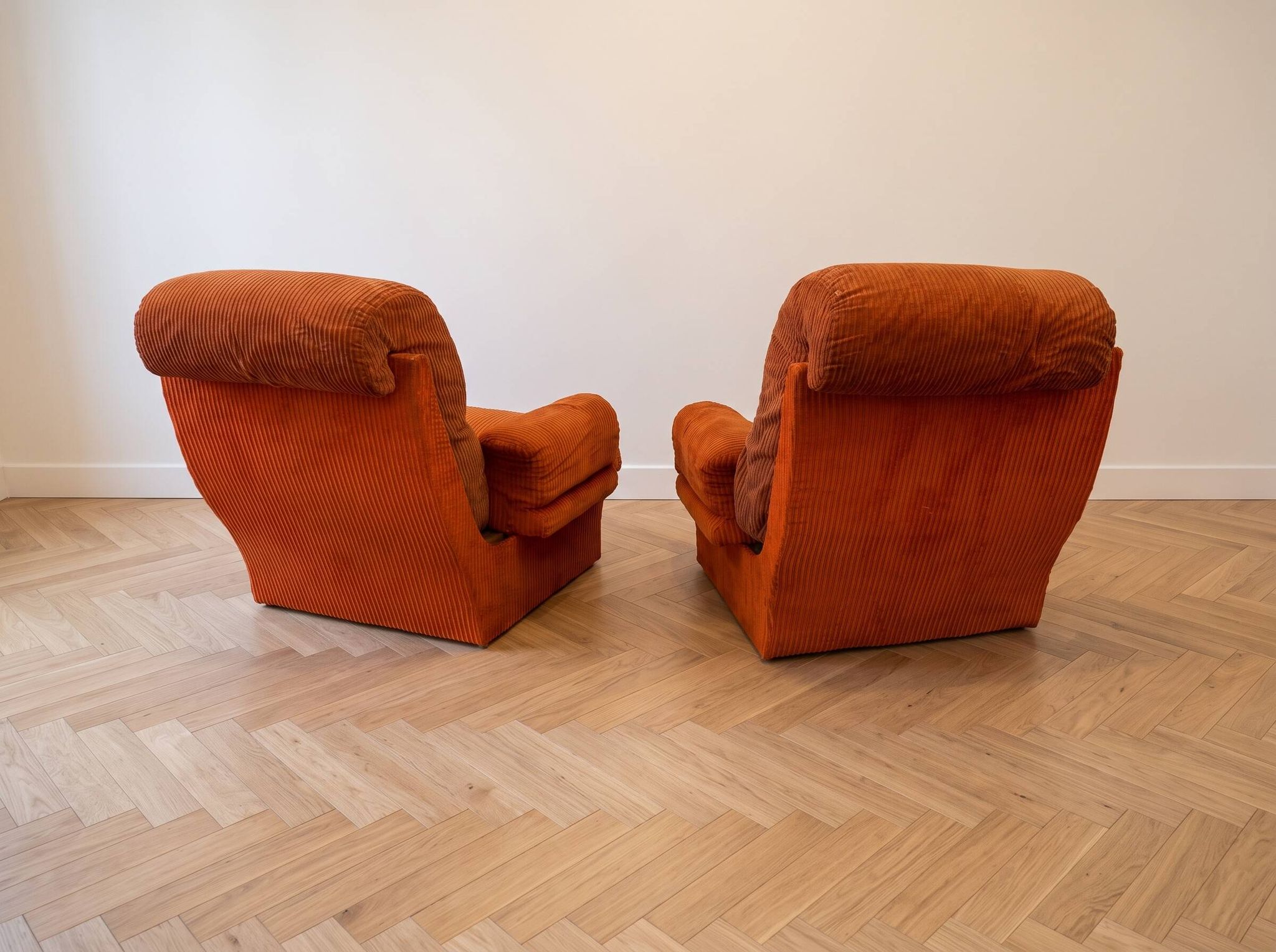 Pair of orange corduroy armchairs, 1970s