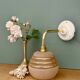 Vintage pink and gold frosted glass globe wall light.