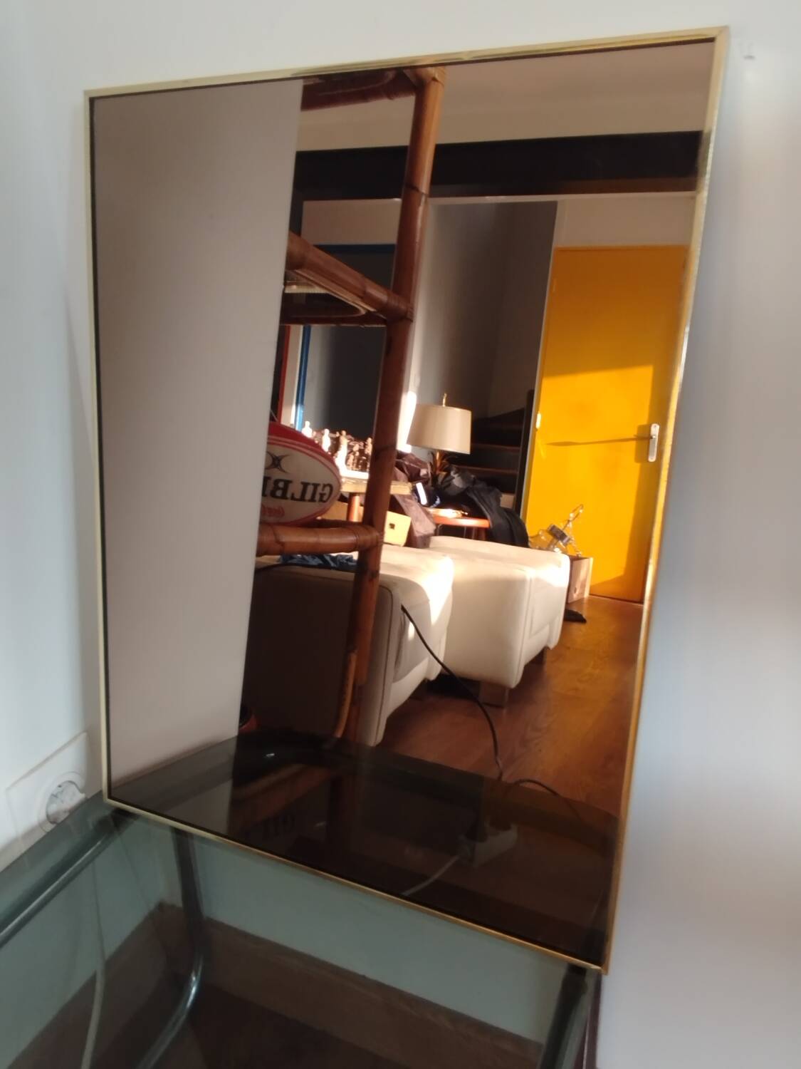 Vintage mirror in gilded brass and smoked glass. circa 1970