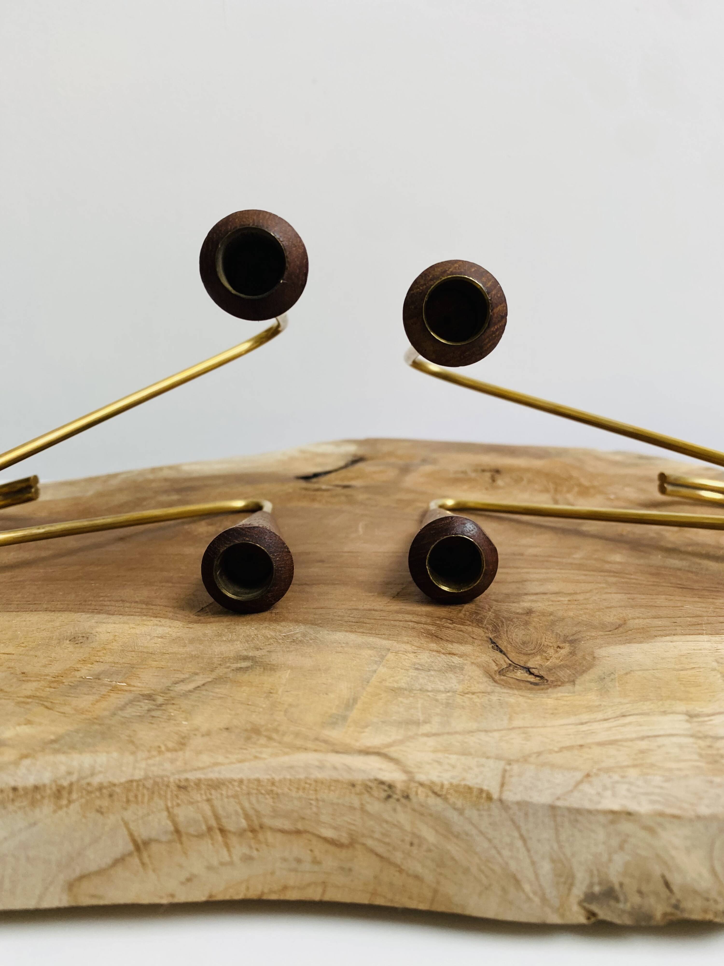 Pair of teak and brass candlesticks