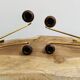 Pair of teak and brass candlesticks