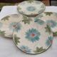Lot de 4 assiettes en barbotine début XXème
