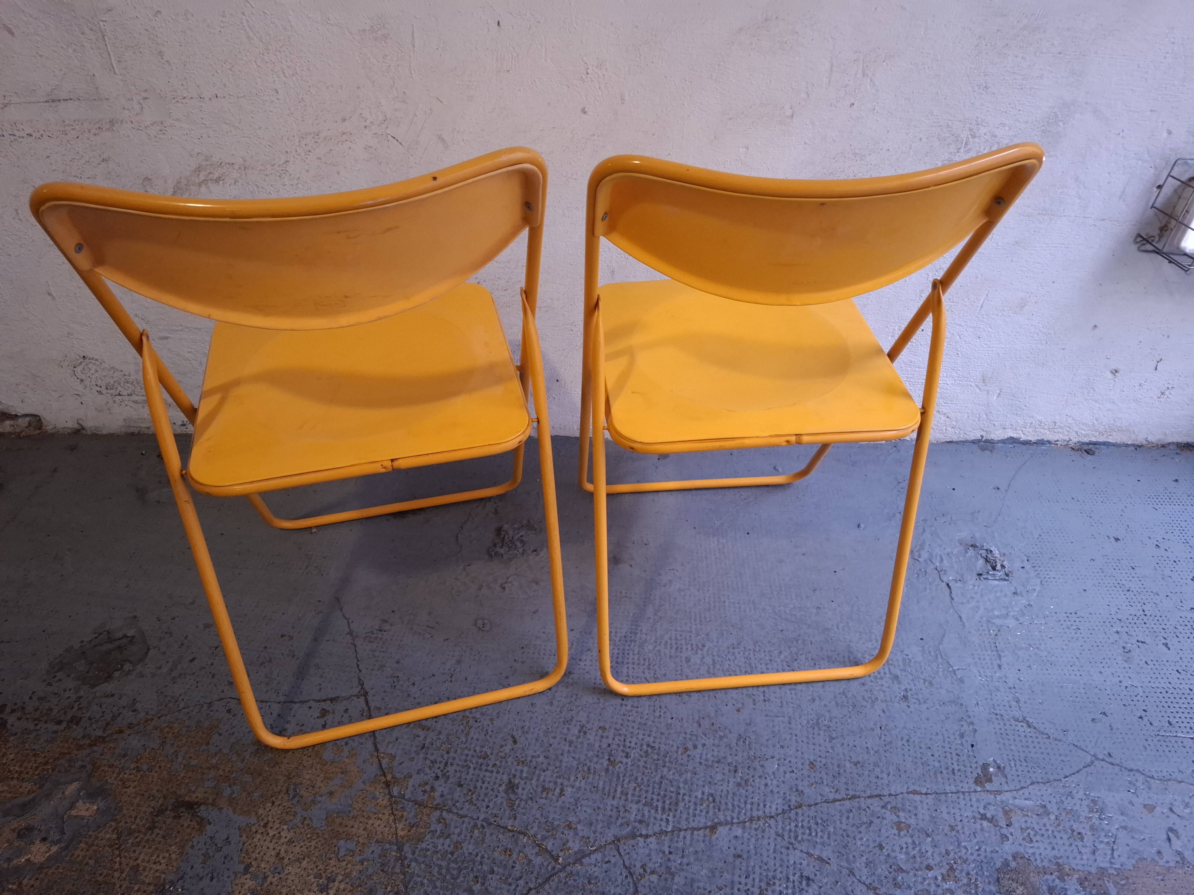Two ikea folding chairs, niels gammelgaard