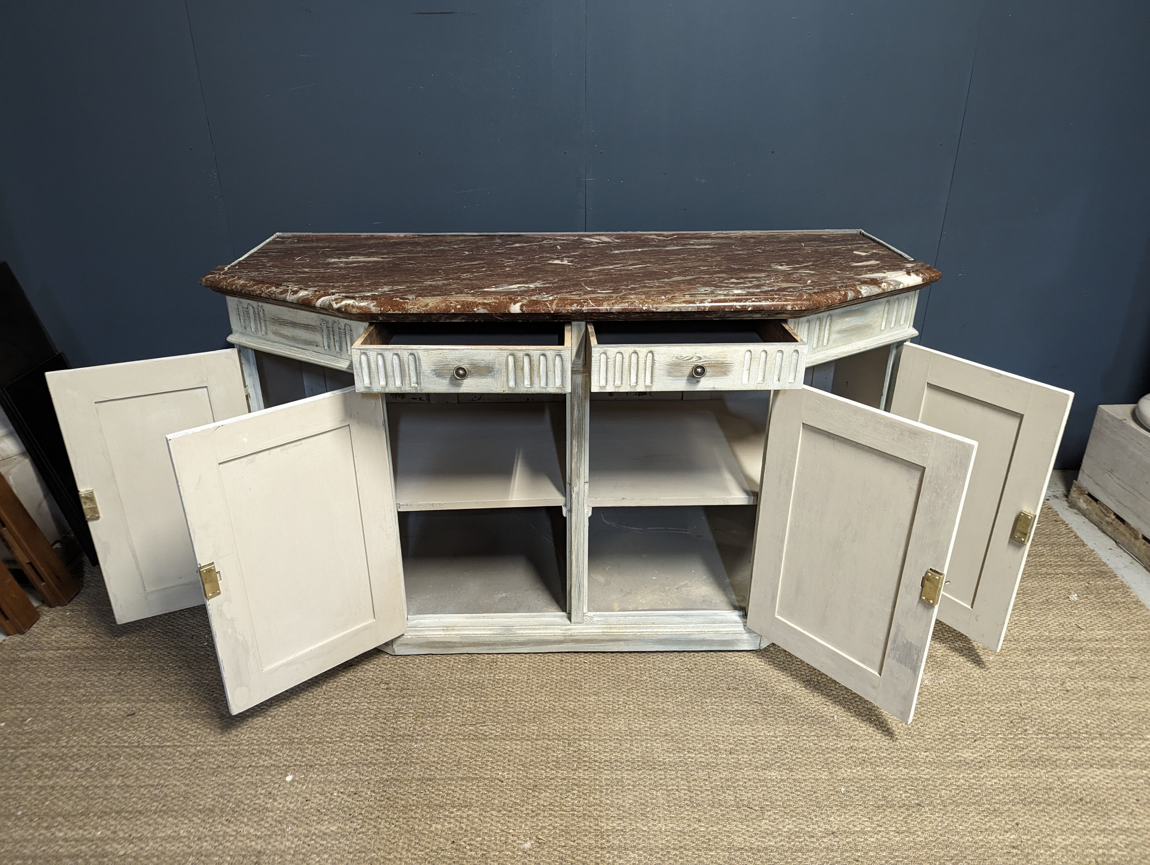 Low patinated sideboard with griotte marble top