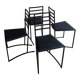 Set of 4 minimalist black steel dining chairs.