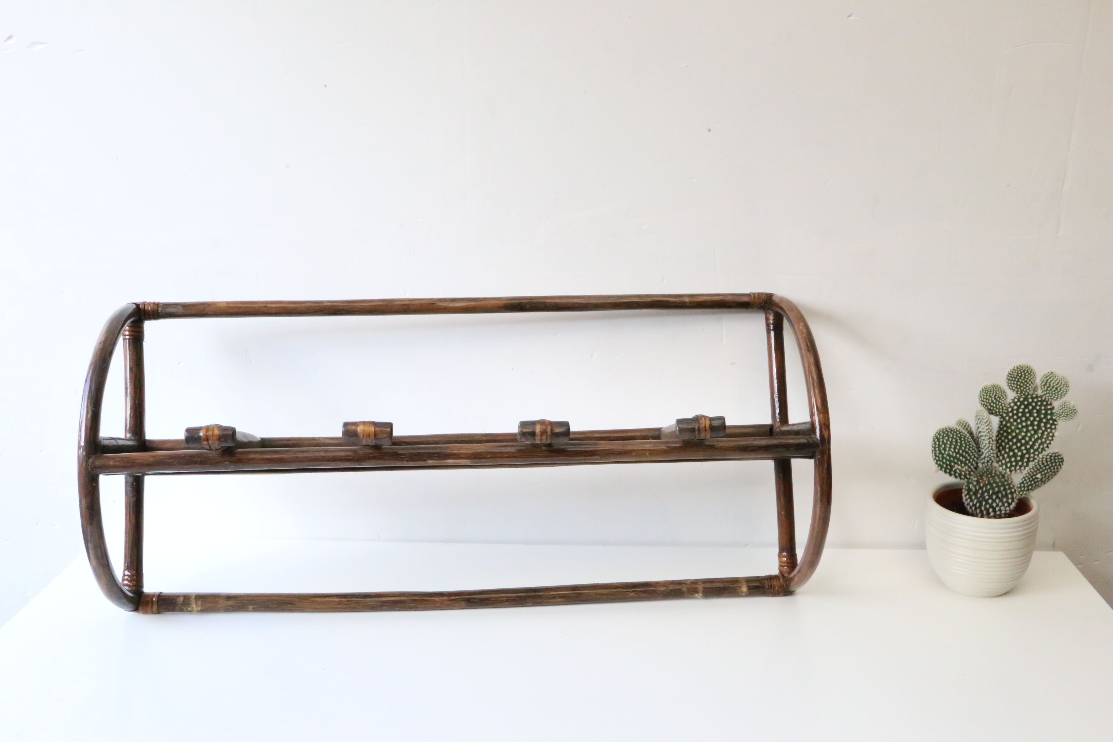 Rattan wall coat holder