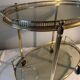 Neoclassical bar cart in gilded brass and smoked glass
