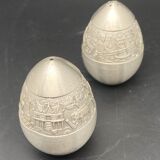 Egg-shaped metal salt and pepper shakers with Asian countryside motif