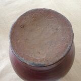 Pitcher has water in glazed stoneware of dark brown color