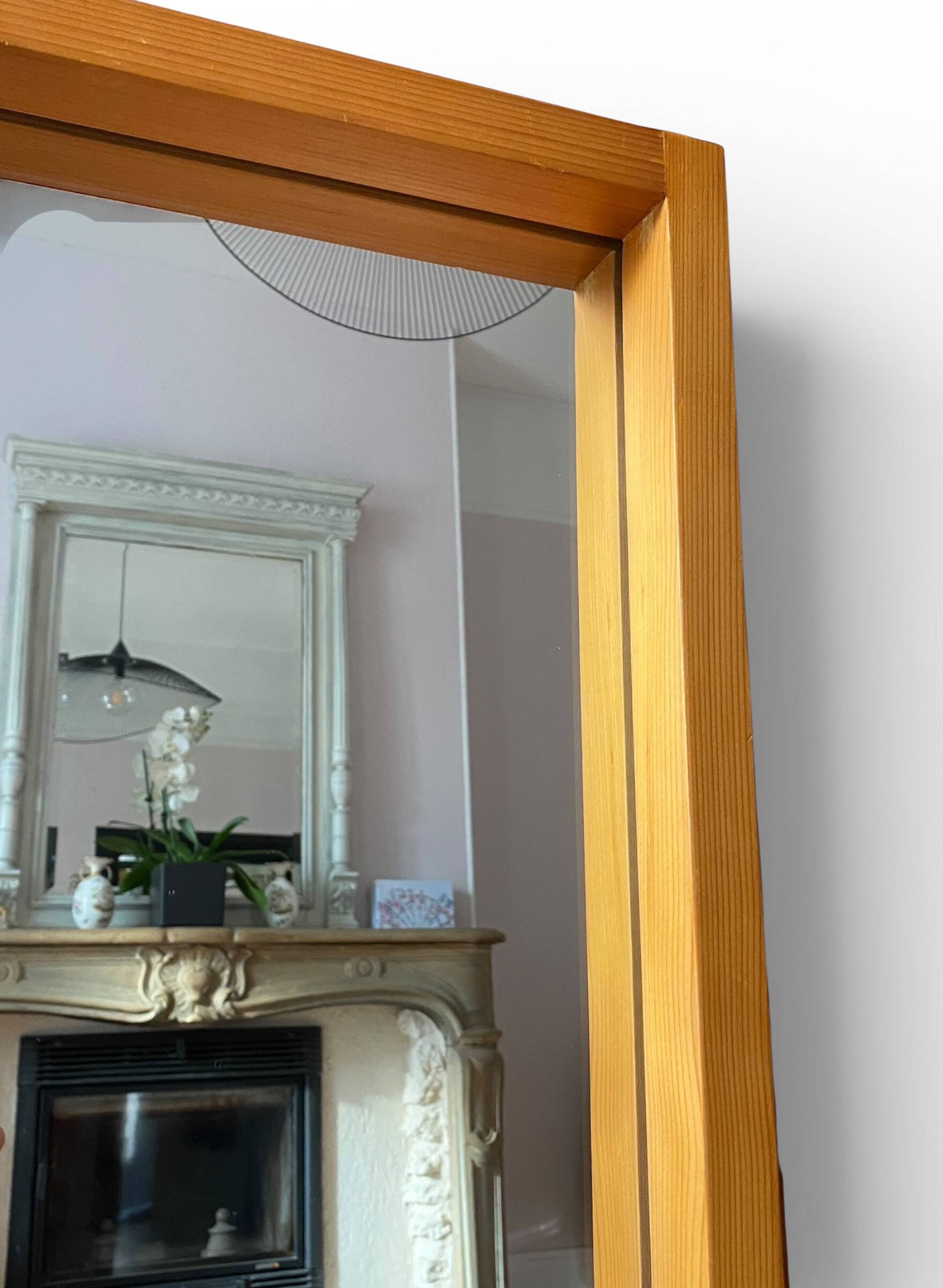 Modernist mirror in solid elm from the 1950s.