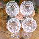 4 lead crystal wine glasses with slender baluster stems.