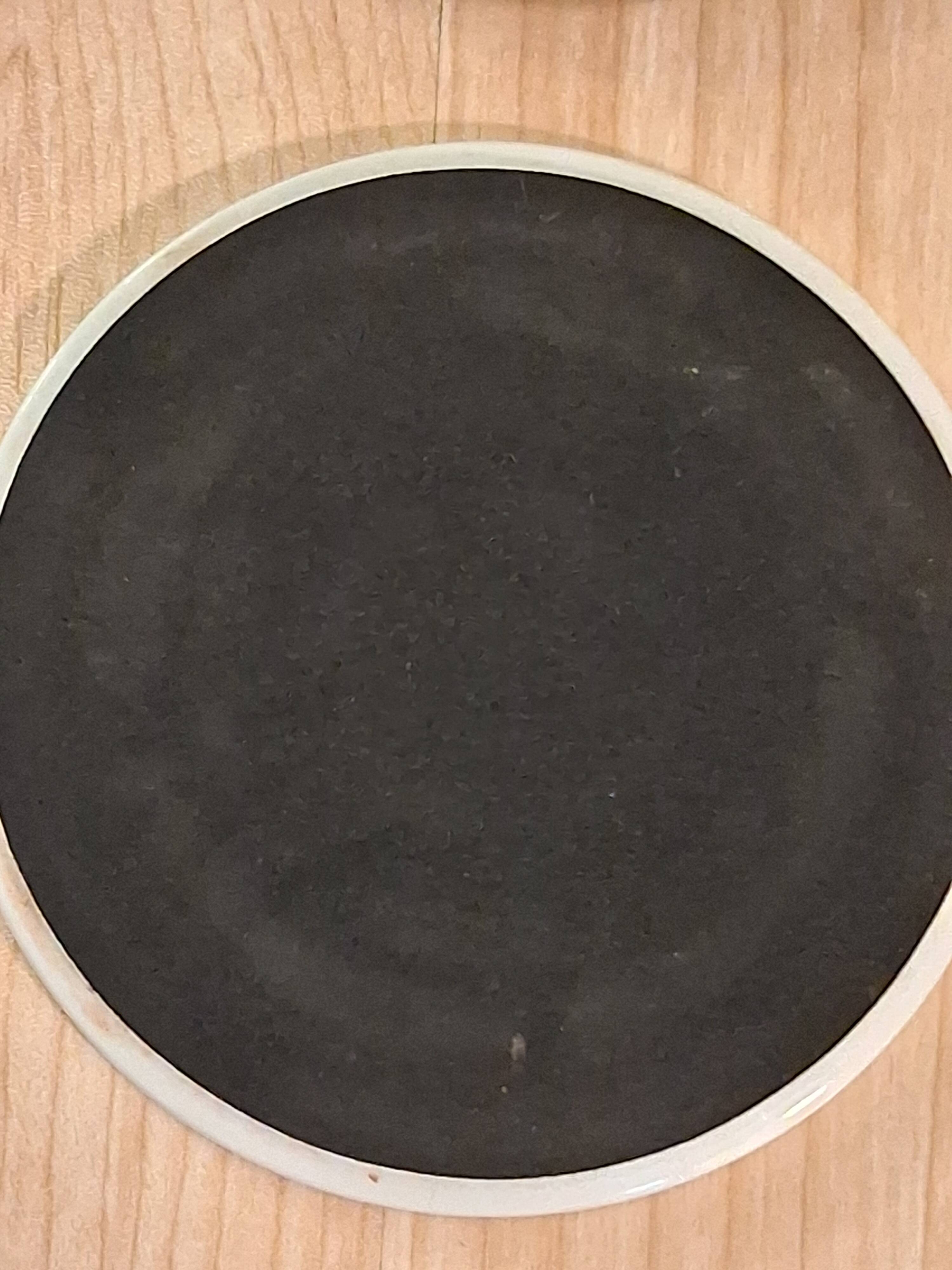 Coasters by the artist Guillaume Cornelis, known as Corneille, from 2001.