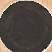 Coasters by the artist Guillaume Cornelis, known as Corneille, from 2001.