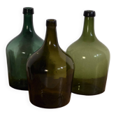 Antique green demijohns (circa 1920). Set of 3 pieces