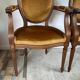 Paire de fauteuils médaillon en bois et velours