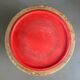 Wooden and red plastic compasses plant stand.