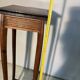 Vintage dark wood side table with curved base