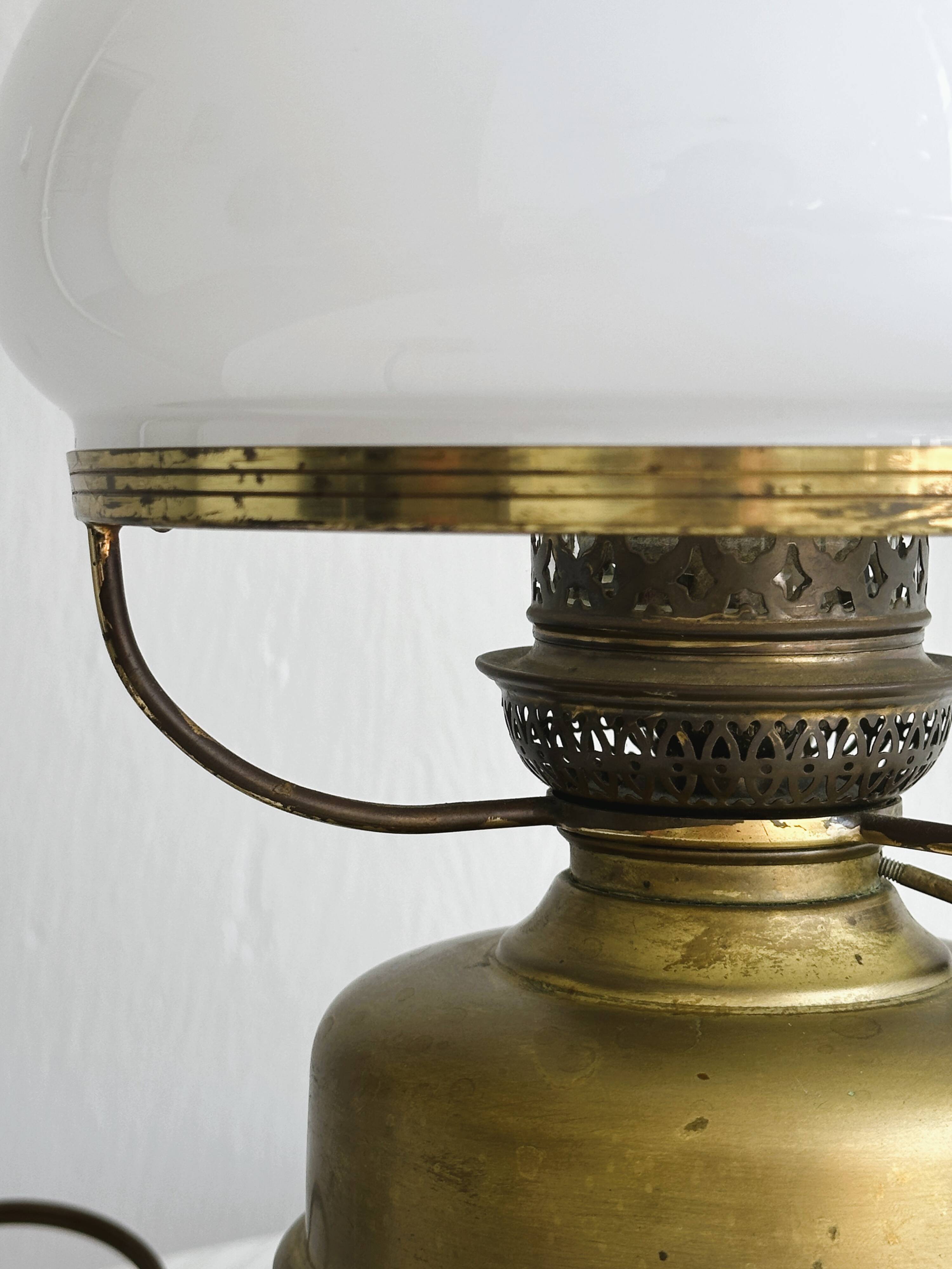 Vintage brass lamp with white opaline glass shade.