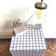 Ceramic tile cube, stool end of sofa