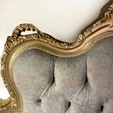 A soft light blue and silver tufted beech wood sofa in Louis style.