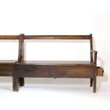 Handcrafted wooden bench with armrest and left drawer.