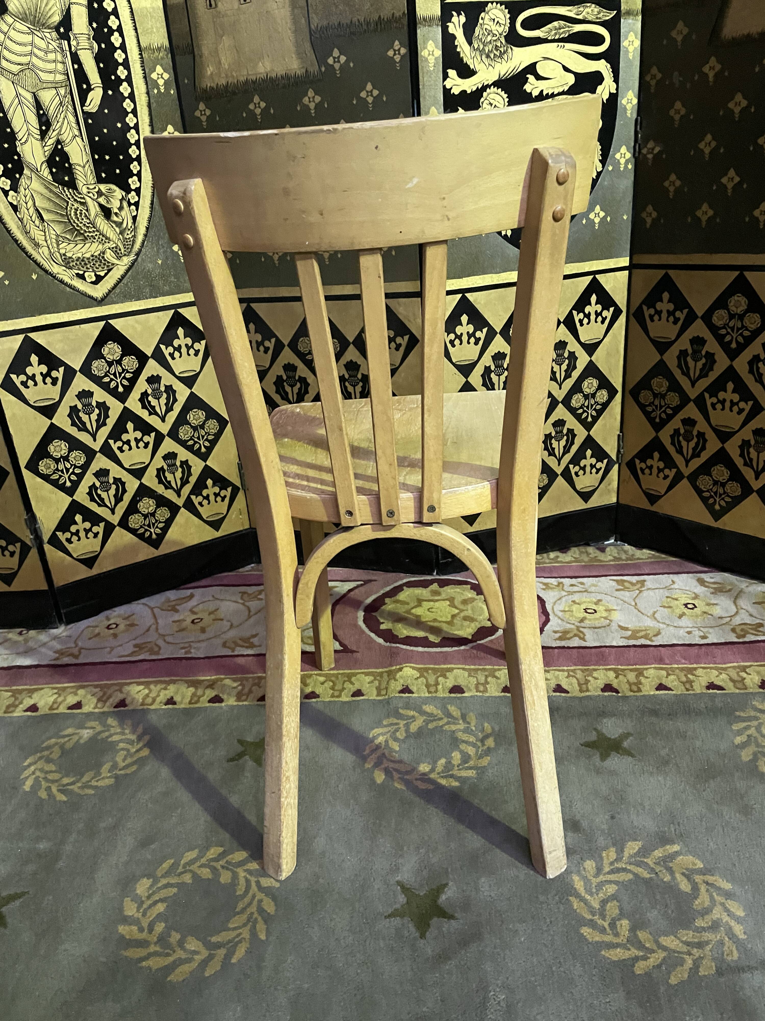 Suite of 6 bistro chairs signed "baumann"