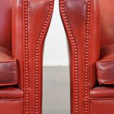 Set of 2 red-colored design armchairs made of sheepskin leather