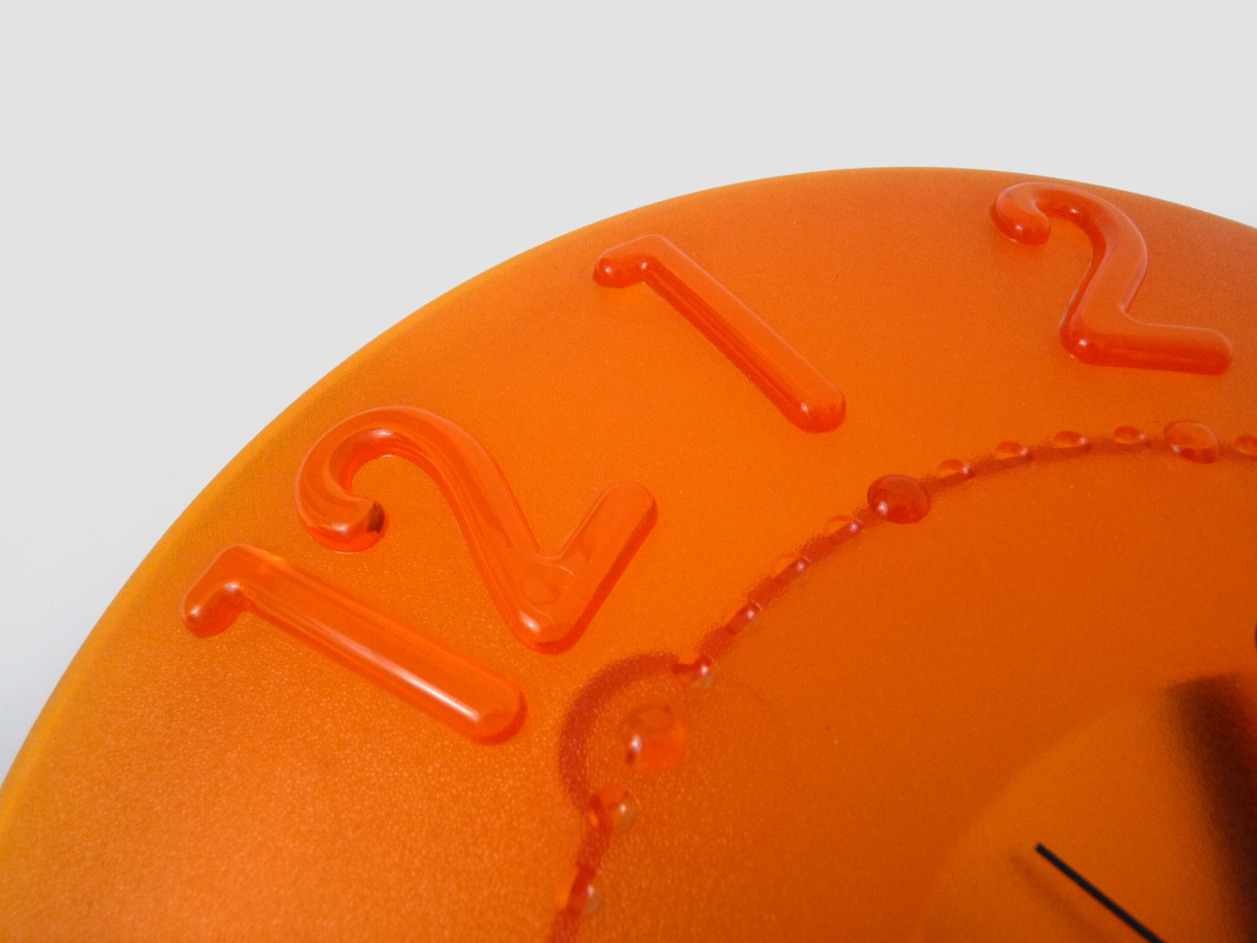 Guzzini orange wall clock from the 1980s