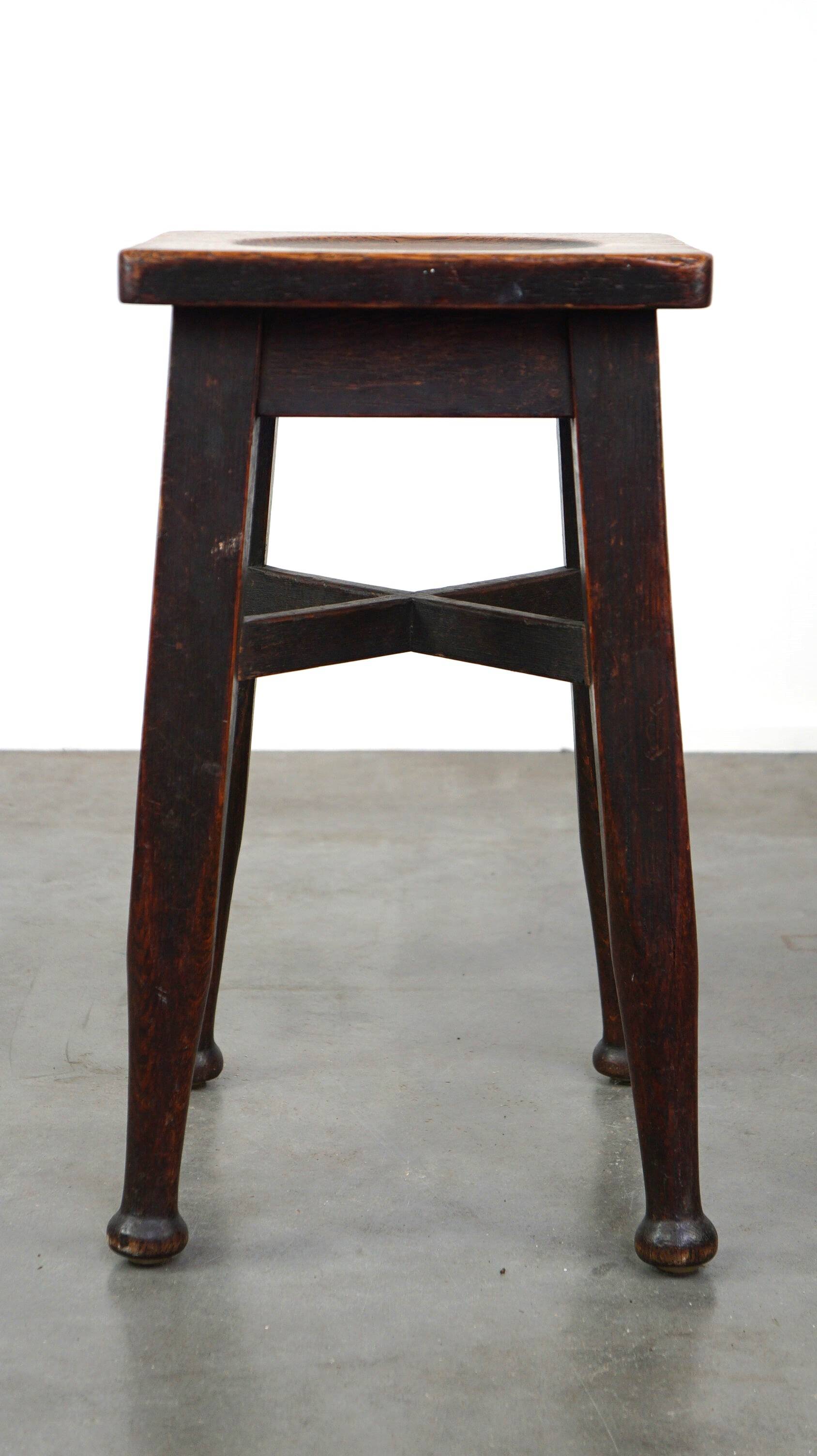Antique English solid oak stool with a touch of art nouveau style