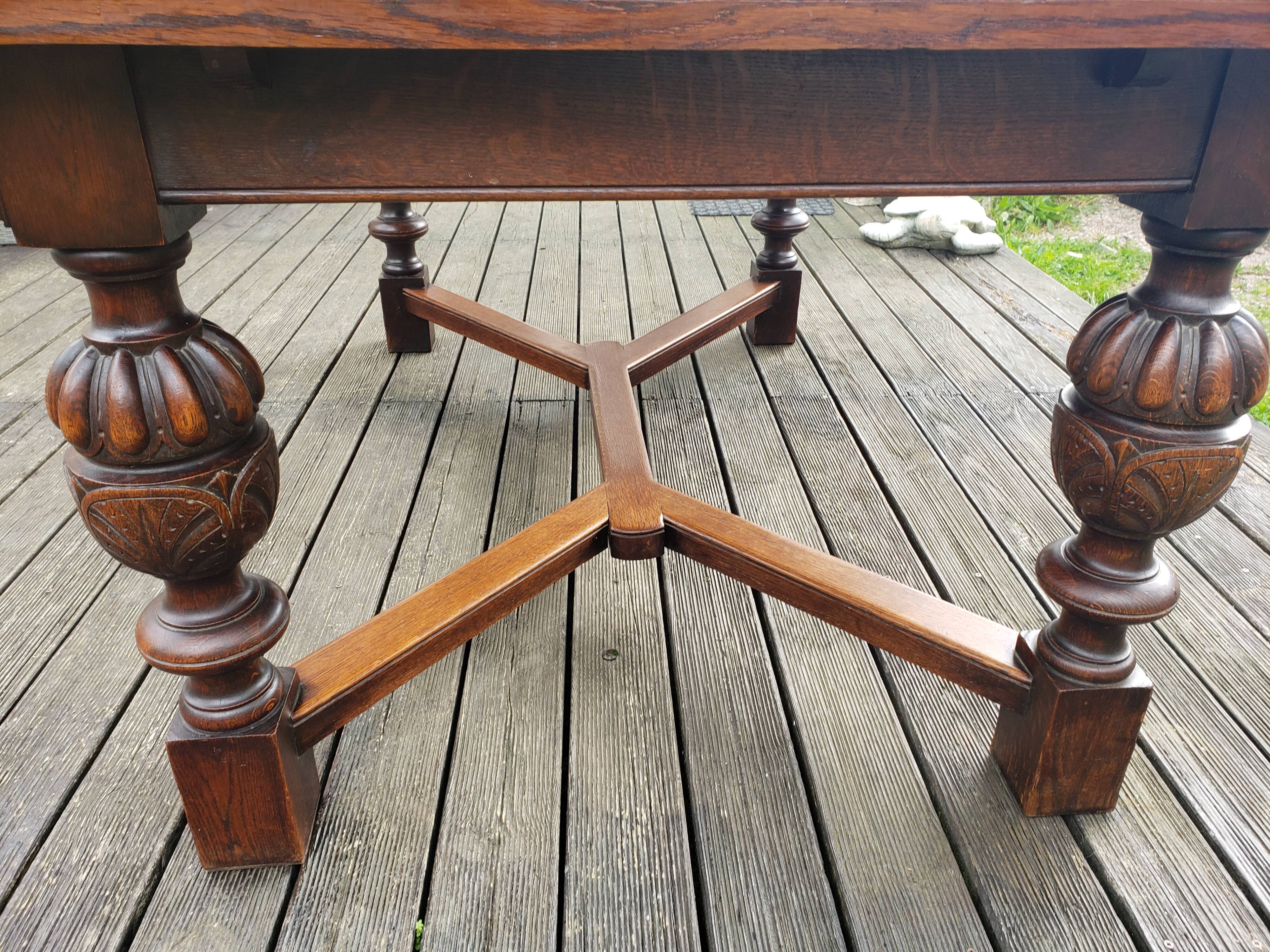 1910s Jacobean style solid oak extending drawer dining table