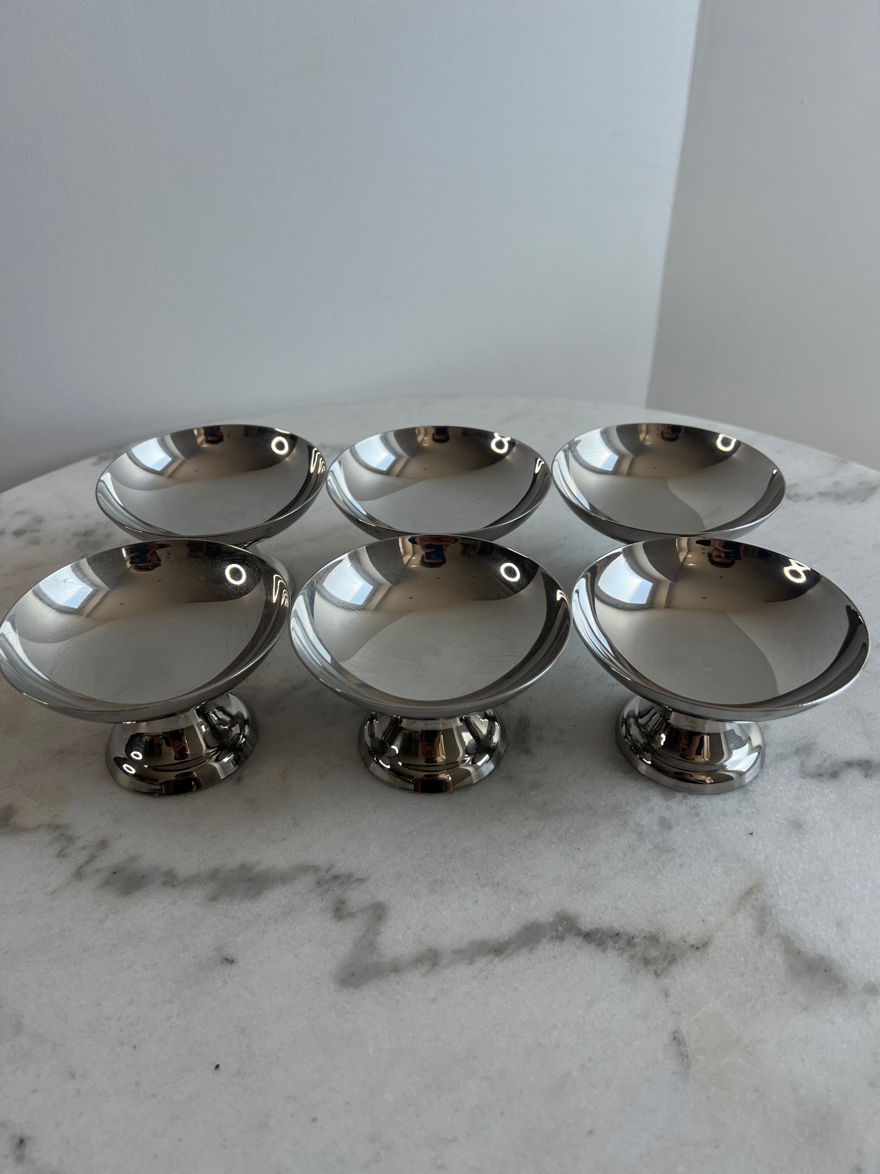 Set of 6 stainless steel dessert bowls on a stand.
