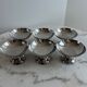 Set of 6 stainless steel dessert bowls on a stand.