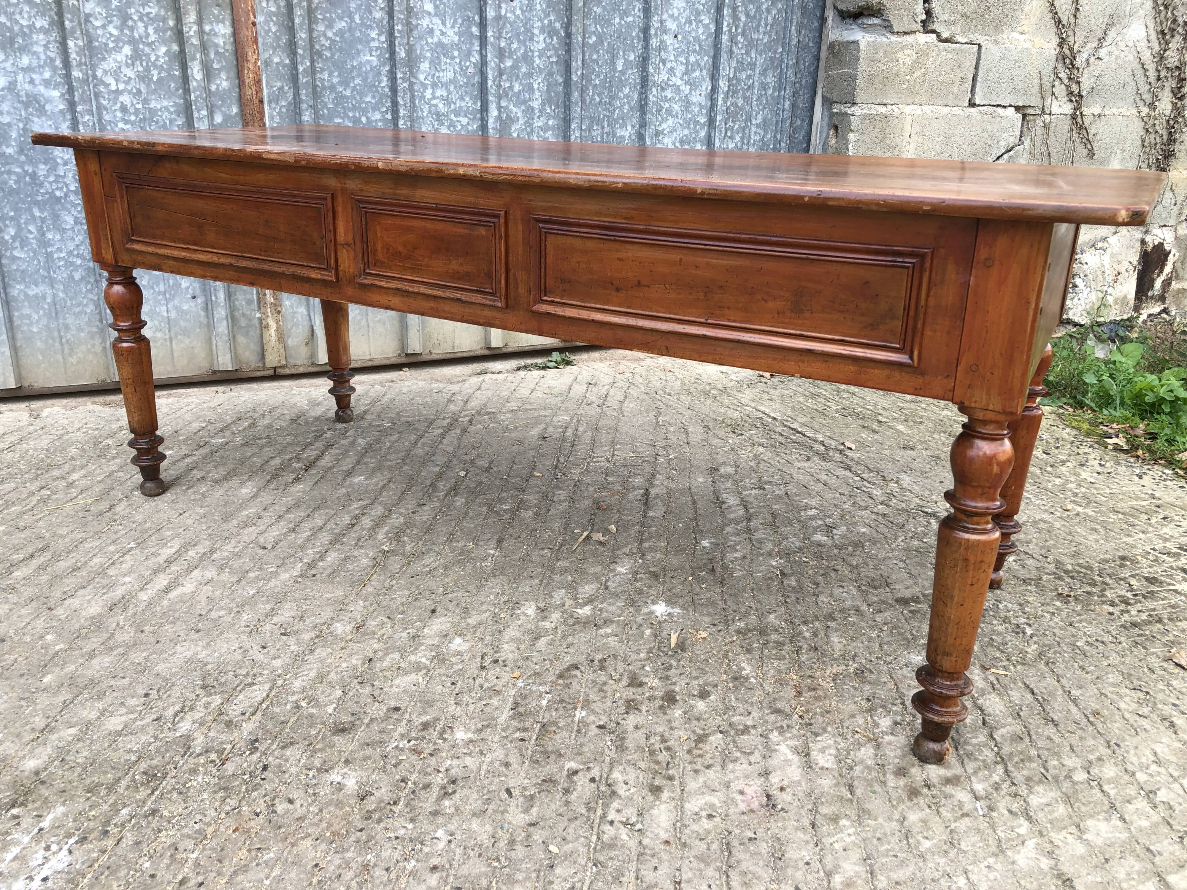 Old farmhouse table in solid cherry wood with 2 front drawers.