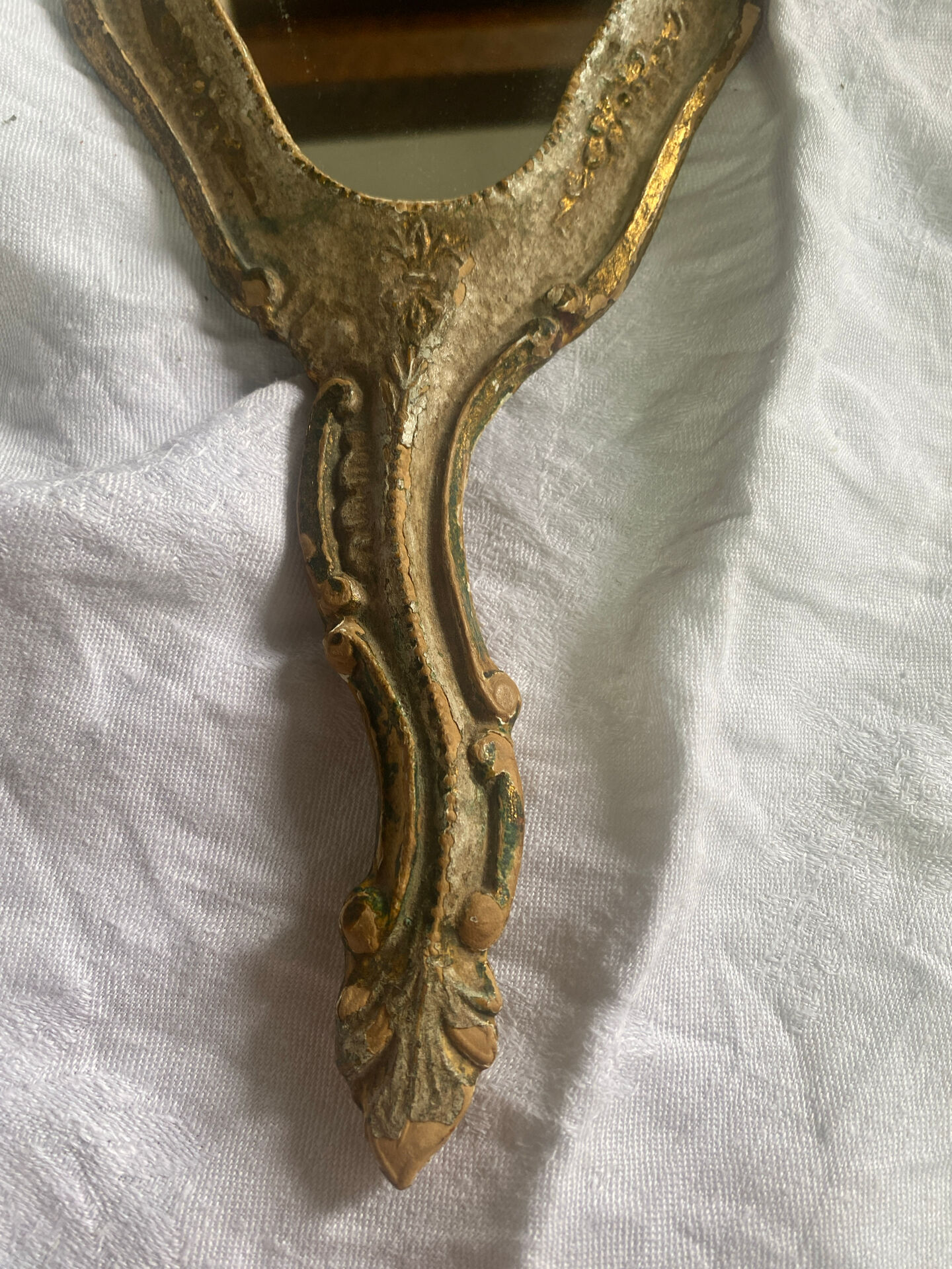 Patinated wooden Florentine hand mirror