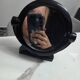 Vintage round pivoting mirror in black, retro style from the 70s/80s.